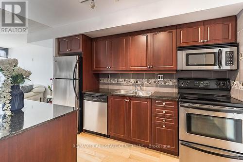 916 - 1040 The Queens Way, Toronto (Islington-City Centre West), ON - Indoor Photo Showing Kitchen With Stainless Steel Kitchen With Double Sink