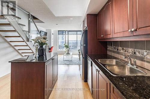 916 - 1040 The Queens Way, Toronto (Islington-City Centre West), ON - Indoor Photo Showing Kitchen With Double Sink