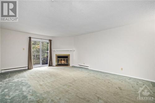 156 Rushford Private, Ottawa, ON - Indoor Photo Showing Living Room With Fireplace