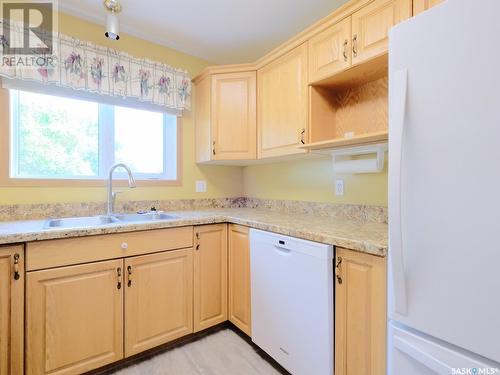 202 212 3Rd Avenue E, Rosetown, SK - Indoor Photo Showing Kitchen With Double Sink