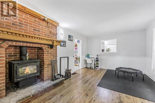 1683 Dunns Line, Severn, ON - Indoor Photo Showing Living Room With Fireplace