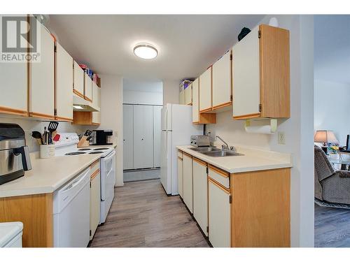 3160 De Montreuil Court Unit# 203, Kelowna, BC - Indoor Photo Showing Kitchen With Double Sink