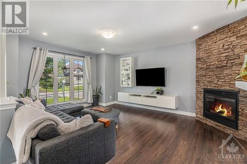 105 Mayer Street, Limoges, ON - Indoor Photo Showing Living Room With Fireplace