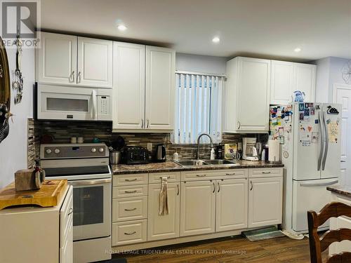 32 Riverside Drive, Kapuskasing, ON - Indoor Photo Showing Kitchen With Double Sink