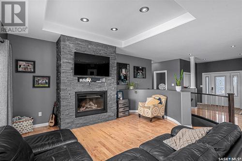 110 Canada Court, Hanley, SK - Indoor Photo Showing Living Room With Fireplace