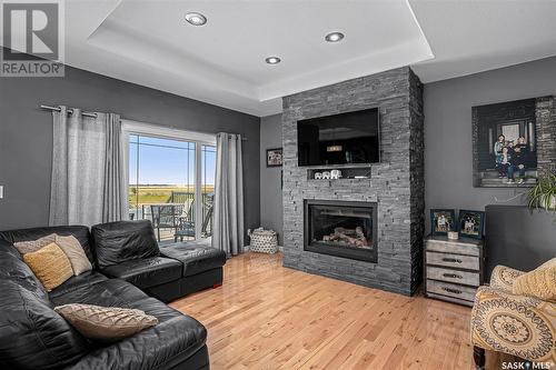 110 Canada Court, Hanley, SK - Indoor Photo Showing Living Room With Fireplace