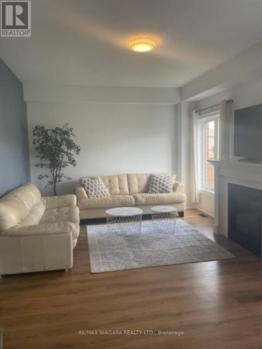 77 Sunset Way, Thorold, ON - Indoor Photo Showing Living Room With Fireplace