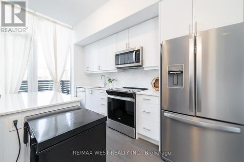 102 - 3220 William Coltson Avenue E, Oakville, ON - Indoor Photo Showing Kitchen With Stainless Steel Kitchen With Upgraded Kitchen