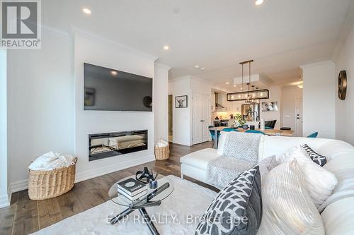 903 - 1880 Gordon Street, Guelph, ON - Indoor Photo Showing Living Room With Fireplace