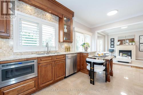 2412 Dunholm Gate, Oakville, ON - Indoor Photo Showing Kitchen With Fireplace With Double Sink