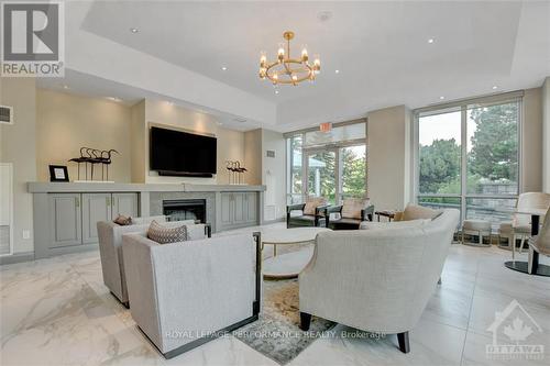 701 - 38 Metropole, Ottawa, ON - Indoor Photo Showing Living Room With Fireplace