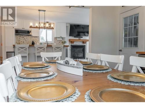 6280 Laurier Avenue, Wardner, BC - Indoor Photo Showing Dining Room With Fireplace