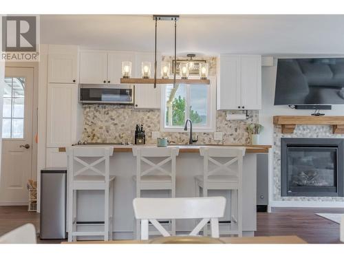 6280 Laurier Avenue, Wardner, BC - Indoor Photo Showing Other Room With Fireplace