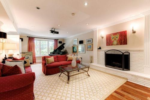 LL Family Room w/Projector TV & Drop Down Screen. - 183 Mill Street, Hamilton, ON - Indoor Photo Showing Living Room With Fireplace