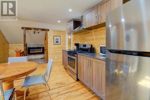 17 Drummond Street, Rideau Lakes, ON - Indoor Photo Showing Kitchen With Fireplace