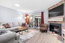 13-970 Springfield Road, Kelowna, BC  - Indoor Photo Showing Living Room With Fireplace 