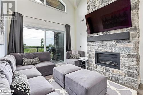 12 Beausoleil Lane Unit# 304, The Blue Mountains, ON - Indoor Photo Showing Living Room With Fireplace