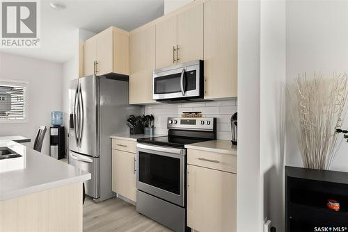 5004 Primrose Green Drive E, Regina, SK - Indoor Photo Showing Kitchen With Stainless Steel Kitchen With Double Sink