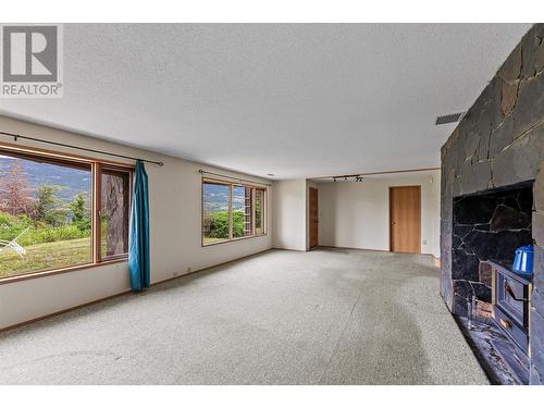 15021 Old Mission Road, Lake Country, BC - Indoor With Fireplace