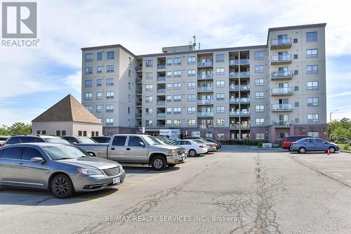 716 - 7405 Goreway Drive, Mississauga (Malton), ON - Outdoor With Balcony With Facade