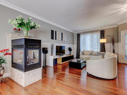 Living room - 120 Rue De L'Argile, La Prairie, QC - Indoor Photo Showing Living Room With Fireplace