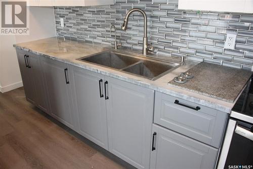 506 4045 Rae Street, Regina, SK - Indoor Photo Showing Kitchen With Double Sink