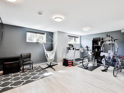 Salle familiale - 118 Rue Des Cuivres, Saint-Colomban, QC - Indoor Photo Showing Gym Room