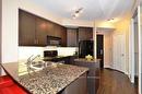 1407-90 Absolute Ave, Mississauga, ON  - Indoor Photo Showing Kitchen With Double Sink 