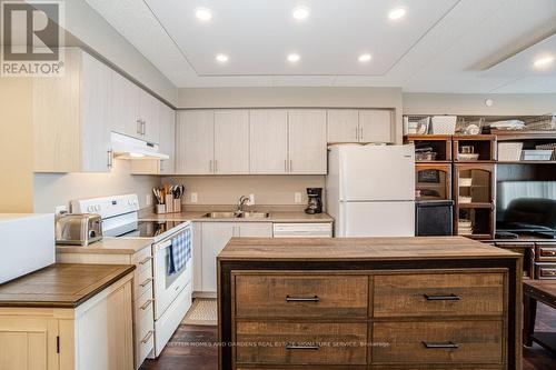 907 - 716 Main Street E, Milton (Old Milton), ON - Indoor Photo Showing Kitchen With Double Sink