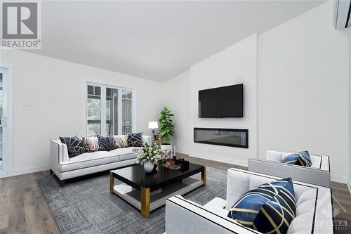 Virtually Staged - 123 St Moritz Trail Unit#702, Embrun, ON - Indoor Photo Showing Living Room With Fireplace