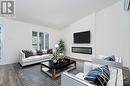 Virtually Staged - 123 St Moritz Trail Unit#702, Embrun, ON  - Indoor Photo Showing Living Room With Fireplace 