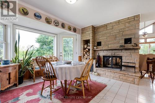 6952 Second Line, New Tecumseth, ON - Indoor Photo Showing Dining Room With Fireplace