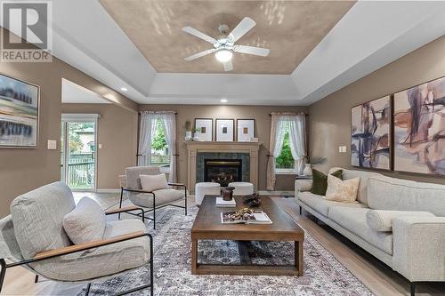 161 Pheasant Run, Lakeshore, ON - Indoor Photo Showing Living Room With Fireplace