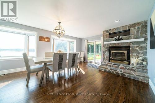 1049 Perry Lane, North Frontenac, ON - Indoor Photo Showing Dining Room With Fireplace