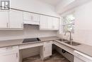 D10 - 240 Ormond Drive, Oshawa, ON  - Indoor Photo Showing Kitchen With Double Sink 