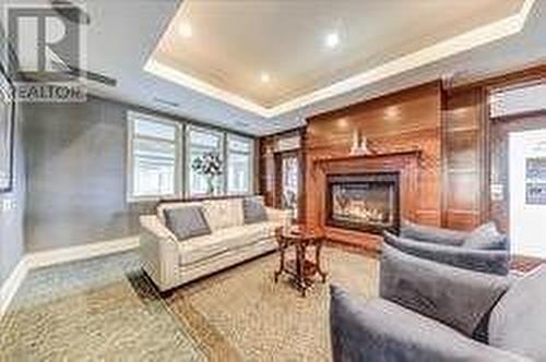 127 - 50 Lakebreeze Drive, Clarington (Newcastle), ON - Indoor Photo Showing Living Room With Fireplace