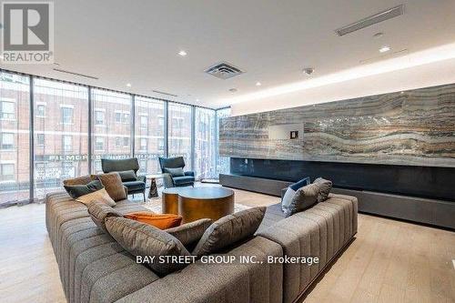 1111 - 219 Dundas Street E, Toronto, ON - Indoor Photo Showing Living Room With Fireplace