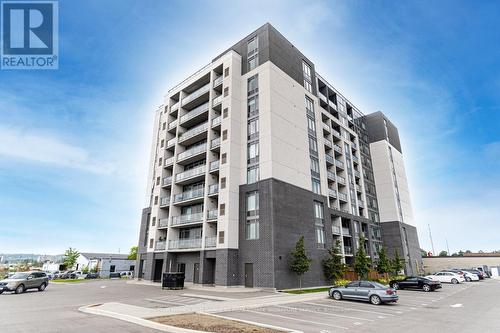 911 - 716 Main Street E, Milton (Old Milton), ON - Outdoor With Balcony With Facade