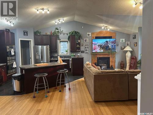 1303 Studer Street, La Ronge, SK - Indoor Photo Showing Kitchen With Fireplace