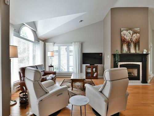 Living room - 22 Av. Godfrey, Saint-Sauveur, QC - Indoor Photo Showing Living Room With Fireplace