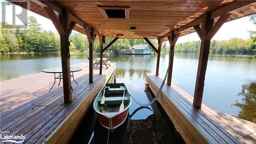 Boat Port at the large dock is easy access to jump in your boat and go out to Six Mile - 285 Huron Trail, Port Severn, ON - Outdoor With Body Of Water