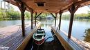 Boat Port at the large dock is easy access to jump in your boat and go out to Six Mile - 285 Huron Trail, Port Severn, ON  - Outdoor With Body Of Water 