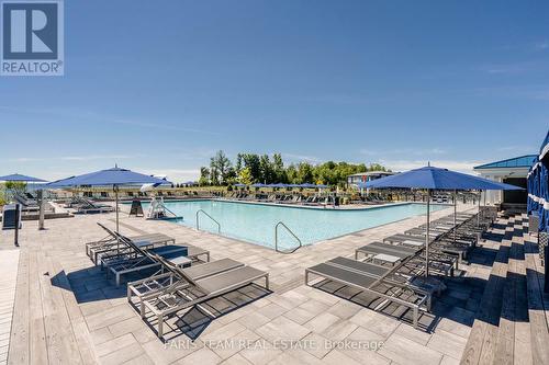 305 - 241 Sea Ray Avenue, Innisfil, ON - Outdoor With In Ground Pool With View