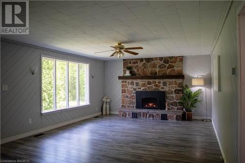 Large living room propane fireplace and updated flooring - 291 Huron Road, Red Bay, ON - Indoor Photo Showing Living Room With Fireplace