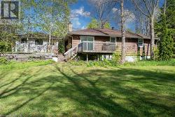 Rear yard w small deck off back to enjoy the sounds of nature - 