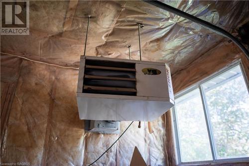 Garage wall furnace keeps the garage toasty for working or parking - 291 Huron Road, Red Bay, ON - Indoor Photo Showing Other Room