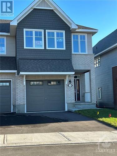 One of builder's most popular townhomes, this 3 bed, 2.5 bath end unit features oversize single garage at 13' x 20', Energy Star features, central air and more...move in before the end of the year! - 333 Kanashtage Terrace, Ottawa, ON - Outdoor With Facade