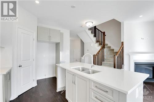 343 Kanashtage Terrace, Ottawa, ON - Indoor Photo Showing Kitchen With Fireplace With Double Sink