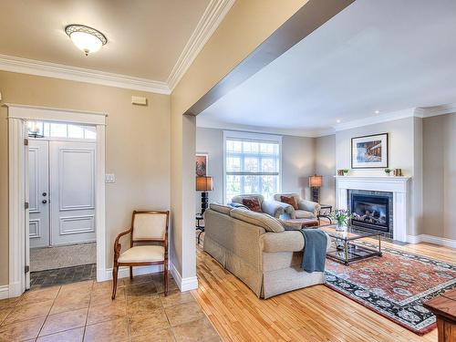 Living room - 432 Rue Des Alismas, Laval (Sainte-Dorothée), QC - Indoor Photo Showing Living Room With Fireplace