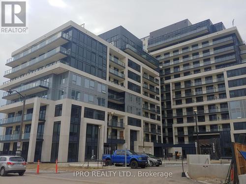 303 - 3200 William Coltson Avenue, Oakville, ON - Outdoor With Balcony With Facade